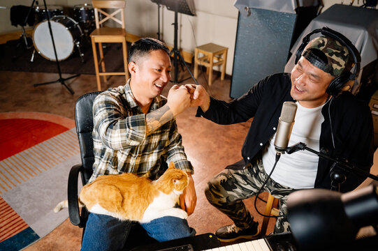 Two Men Making Music In Studio