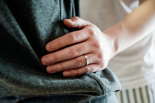 Close Up Of Man's Hand On His Wife's Waist