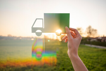 Hand holding logistics symbol in nature