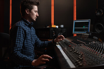 Male Producer Working In The Music Studio