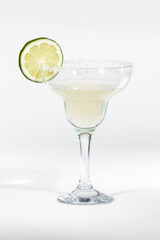 Isolated Margarita with a lime wedge over a white background 