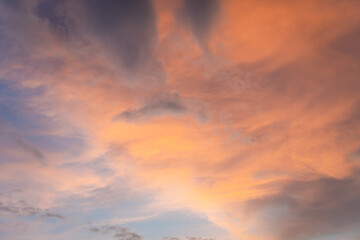 Beautiful sunset and sunrise twilight blue, orange sky, and clouds in the morning above clouds with dramatic light.