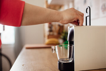 Woman preparing espresso 
