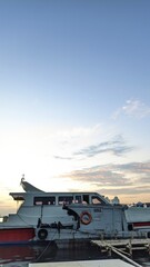 Fototapeta na wymiar jakarta, indonesia - mei 24, 2022: beautiful sea view and afternoon boat on a pier