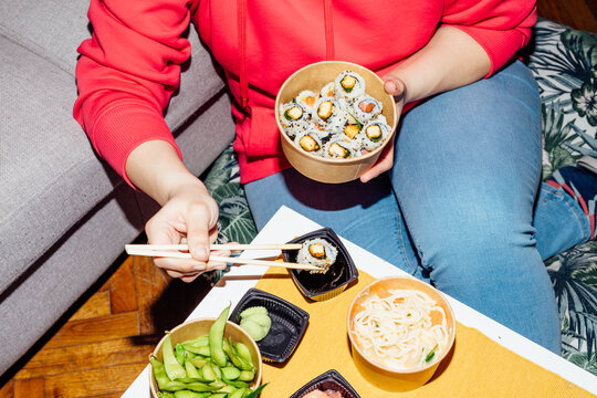 Woman eating sushi
