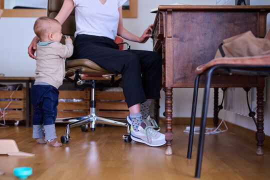 Baby bothering working mother