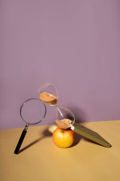 Magnifier, Sand Clock, Apple And Notebook