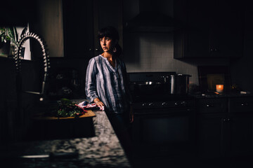 Woman washing vegetables