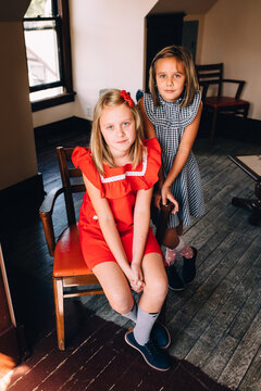 Sisters in dresses. 