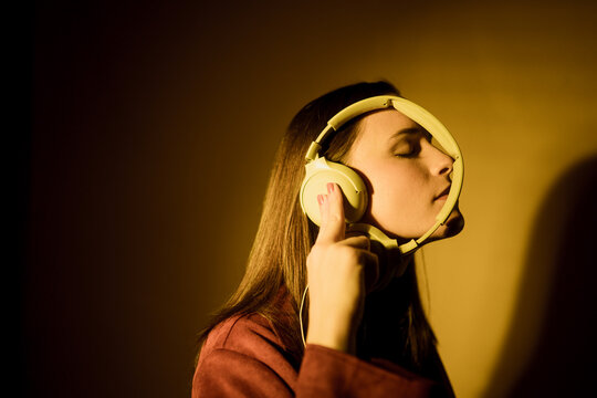 Girl listening to music with headphones 