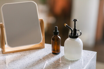 Skincare products and tabletop mirror