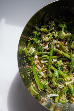 Large bowl of salad with farro and asparagus