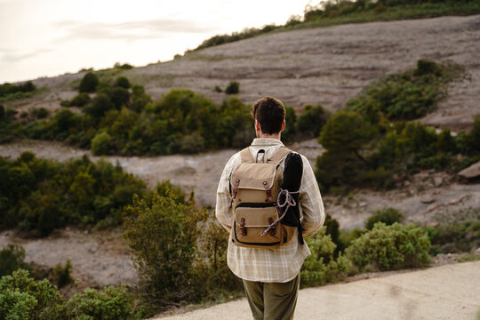Man hiking in the mountain  wearing backpack
