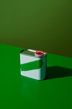 white motor oil can with a green brushstroke