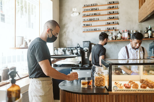 Waiter working on a coffee shop