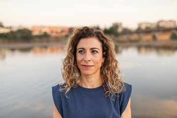 portrait of caucasian woman next to a river