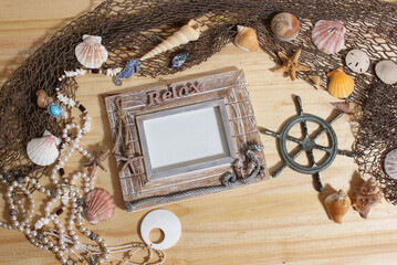 Empty Frame on Wooden Background With Sea Shells and Fishing Net. Nautical and Coastal Theme
