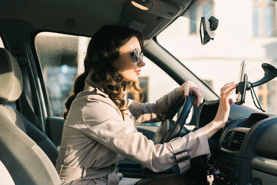 Woman setting up GPS navigation