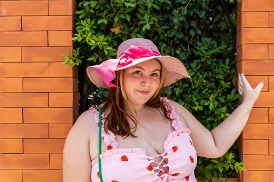 Plus size gen z woman poses for a portrait