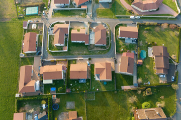 Aerial view of residential houses in green suburban rural area