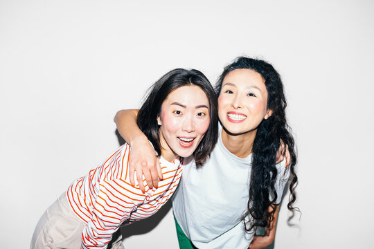 Two Asian Women Posing in Studio