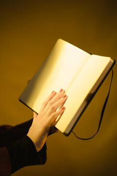 Woman's hands with blank notepad