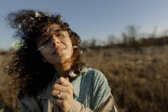 beautiful curly girl walking in the field