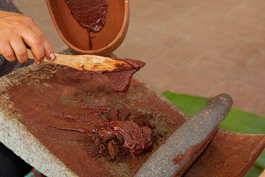 Cocoa melted on a metate in Oaxaca Mexico