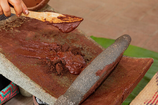 Cocoa melted on a metate in Oaxaca Mexico
