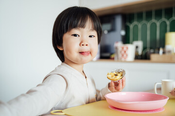 Little Asian girl at home
