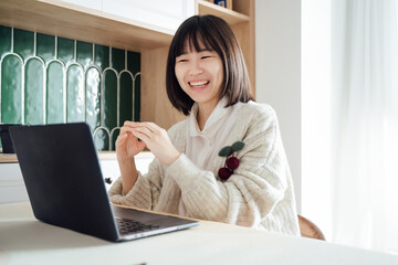 Asian woman working at home