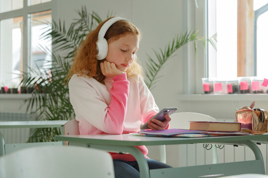 Schoolgirl watching video during break