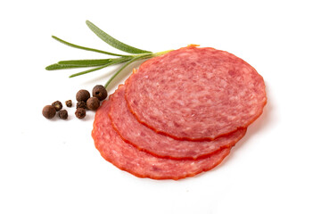 Sliced round pieces of salami sausage with rosemary leaf on a white background.