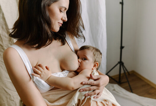 woman breastfeeding her son