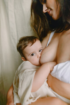 woman kissing baby's heel