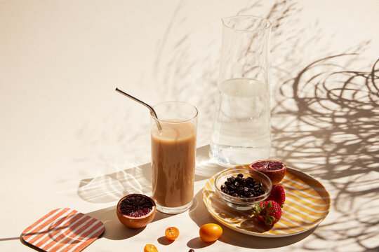 Glass of iced latte with a straw