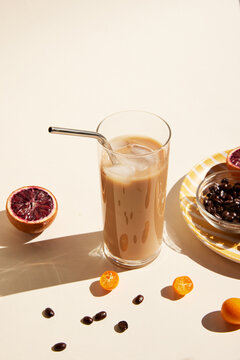 Glass of iced latte with a straw