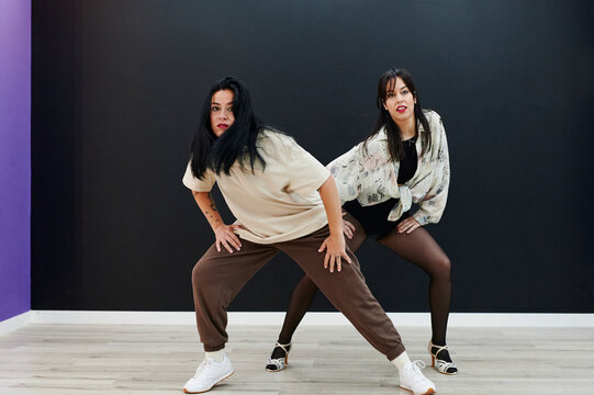 Women dancing during a rehearsal in a studio