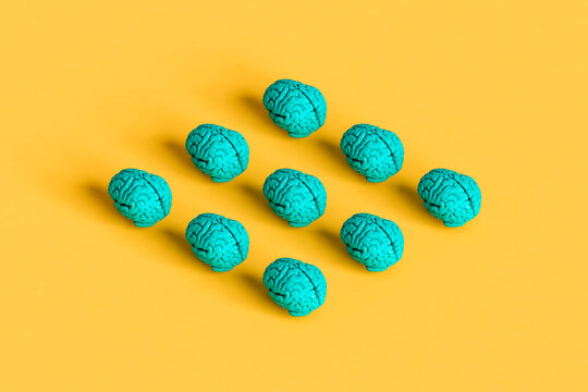 collection of blue brains on a yellow background