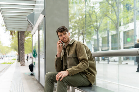 Man making phone call at metro stop