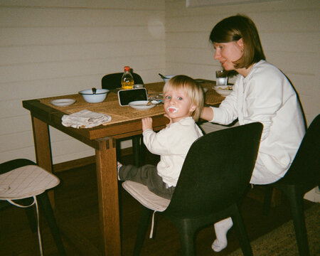 Young mother with som have dinner 