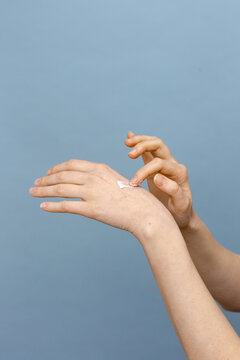 Beautiful Young Woman Hands With Cream