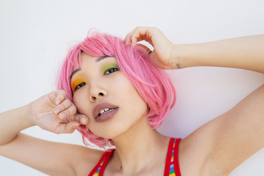 Asian woman with pink hair
