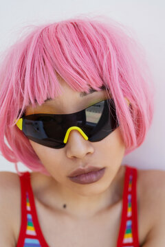 Trendy Asian female in black sunglasses