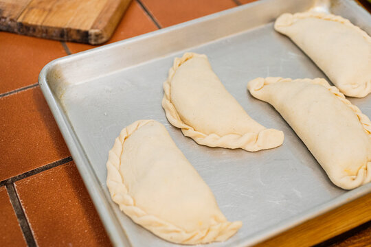 Argentinian empanadas on an aluminum tray 
