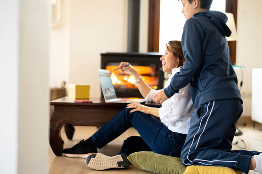 Mother Explaining Project To Teen Son