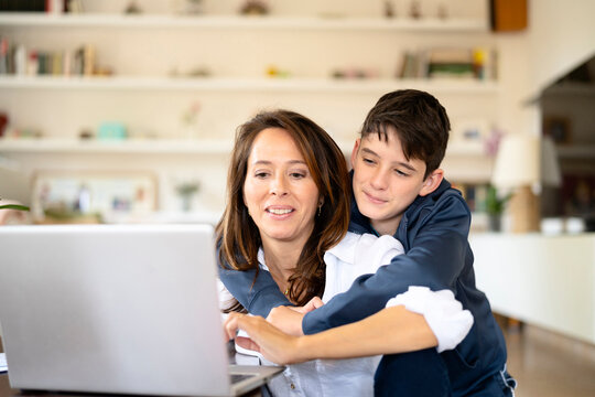 Mother and son analyzing data together