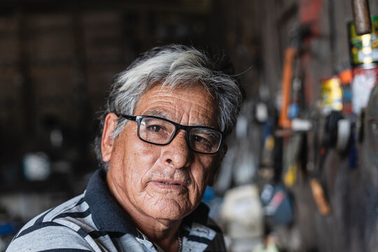 portrait of an old man looking at the camera