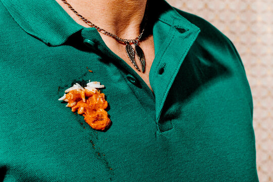 man with a stain of chicken tikka masala