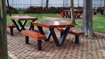 Wooden patio chair reclaimed wood outdoor dining table on tropical rainforest.